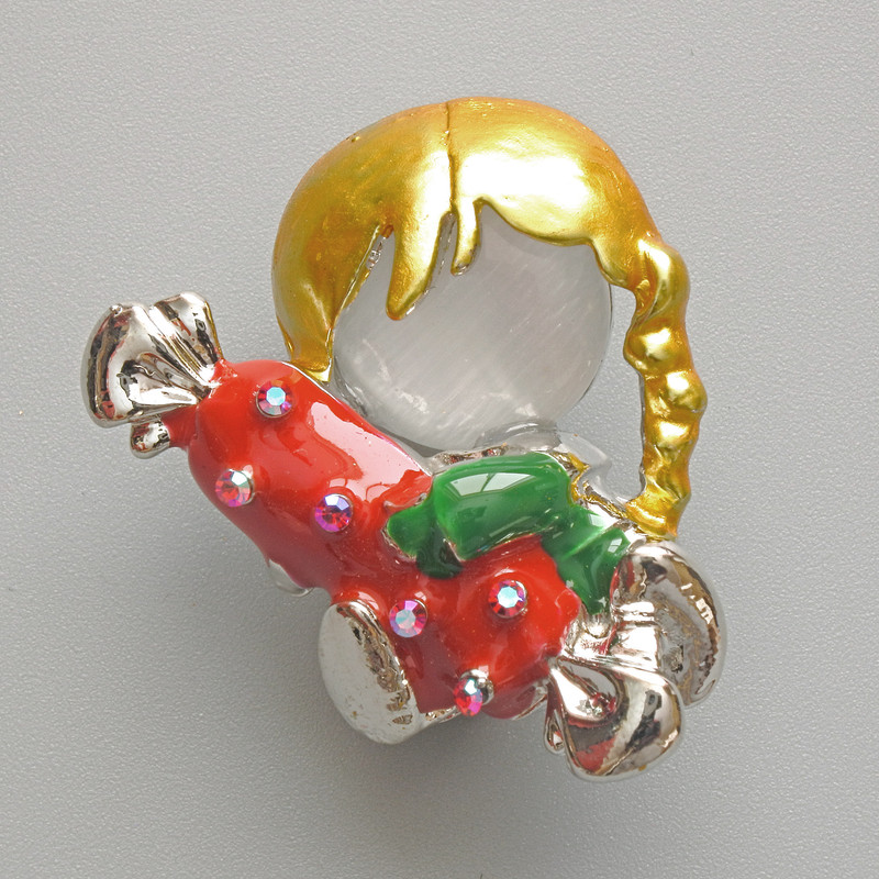 Brooch 'Girl with Candy' with white cat's eye, red and green enamel, chameleon rhinestones, silver metal 25x30mm